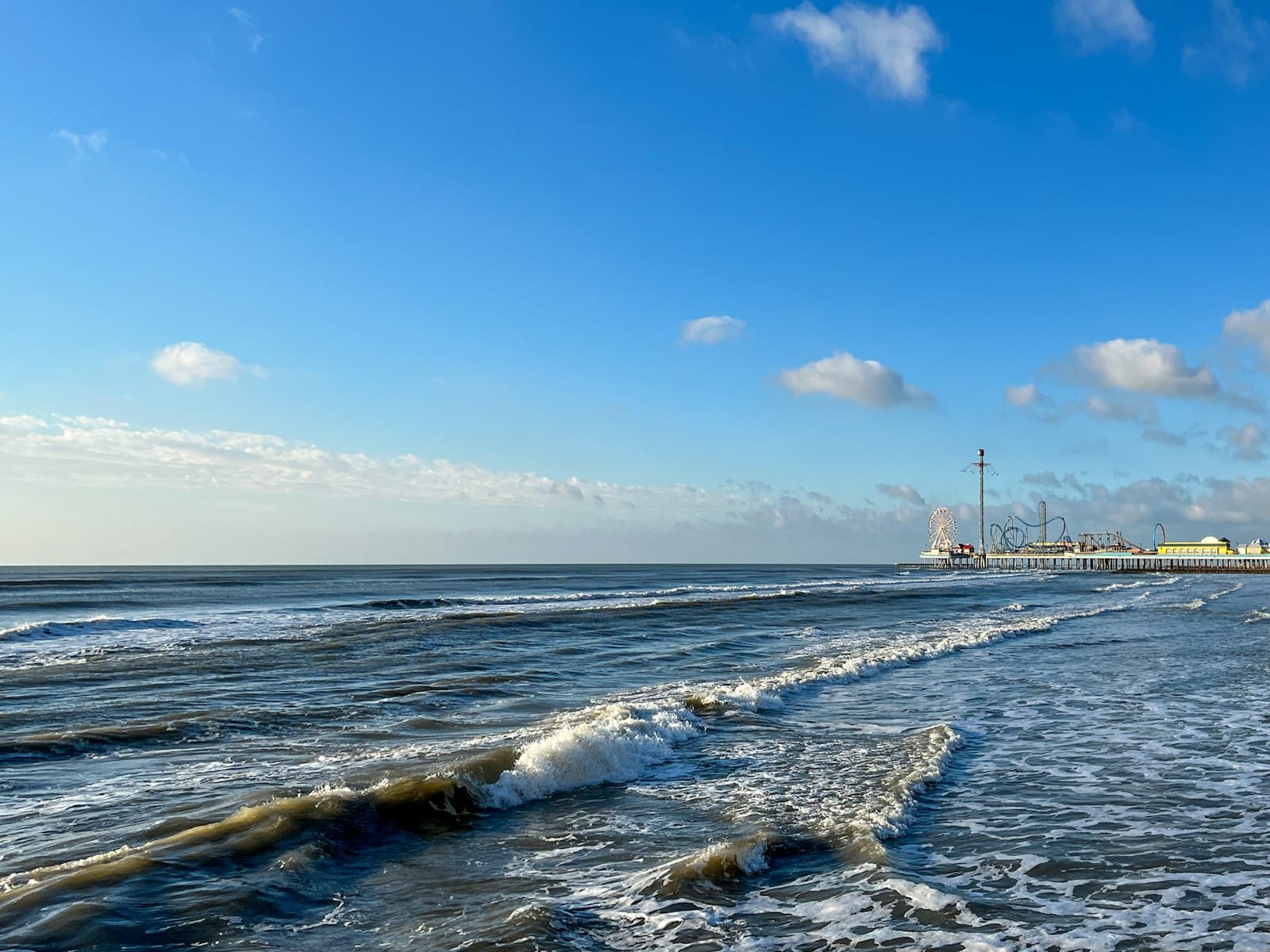 Galveston beach with Pleasure Pier in the distance